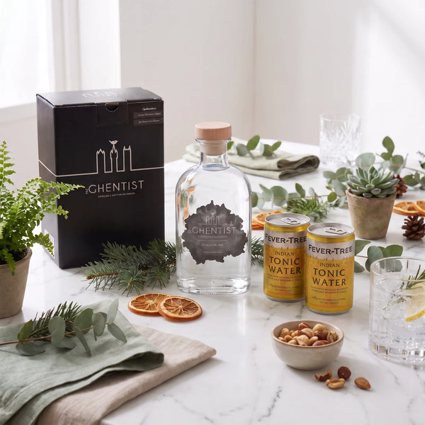 The Ghentist Gin & Tonic Box styled on a table with gin, tonic, dried orange and a gin and tonic glass